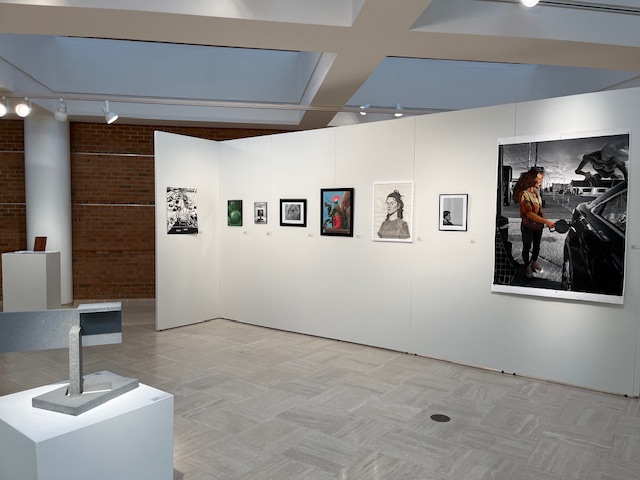 inside front wall of the student show with various works of art